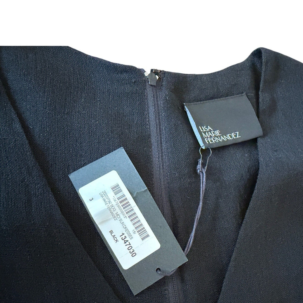 Black garment with tags on a white background