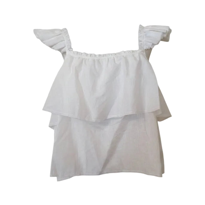 White ruffled blouse on a mannequin against a white background