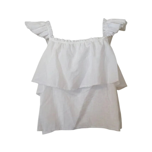 White ruffled blouse on a mannequin against a white background