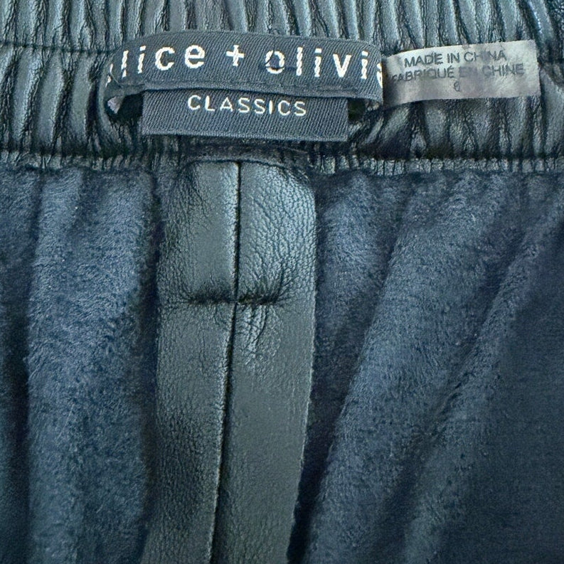 Close-up of a blue garment with a visible brand label on a white background