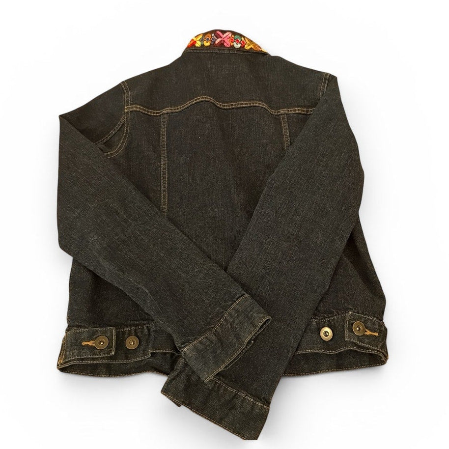 Dark denim jacket with floral pattern on collar against a white background