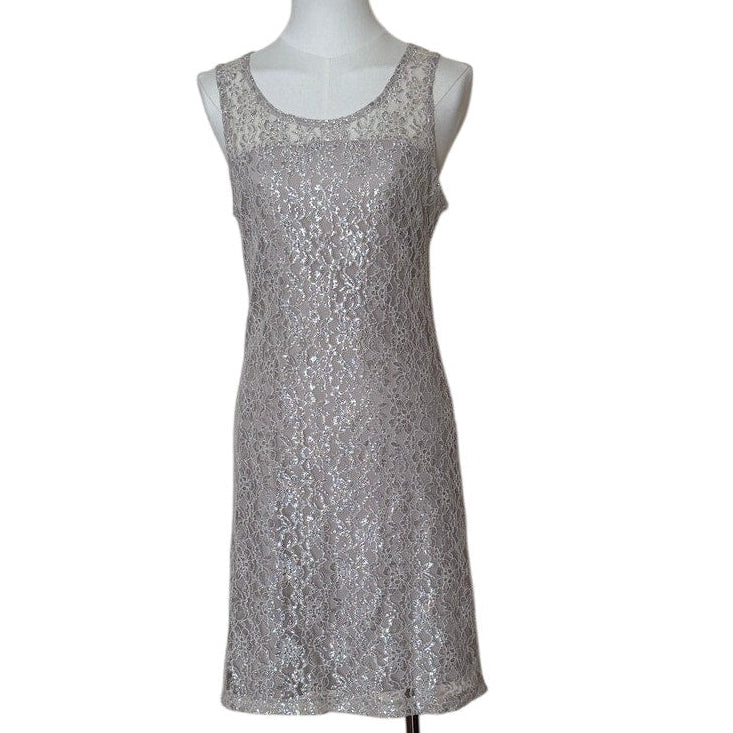 Silver sequin dress on a mannequin against a white background
