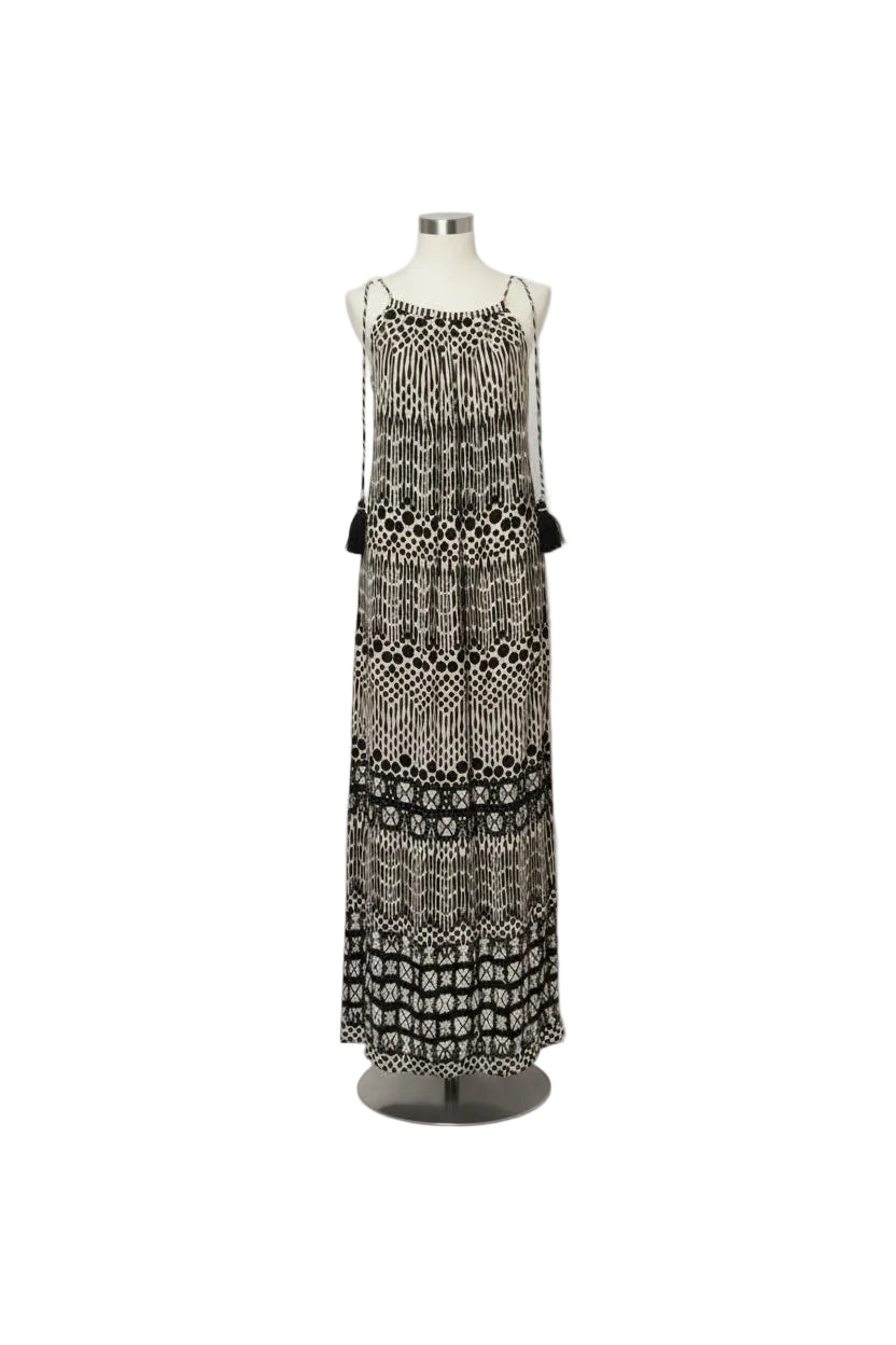 A sleeveless black and beige bohemian-style maxi dress with an intricate geometric pattern, displayed on a mannequin against a white background.