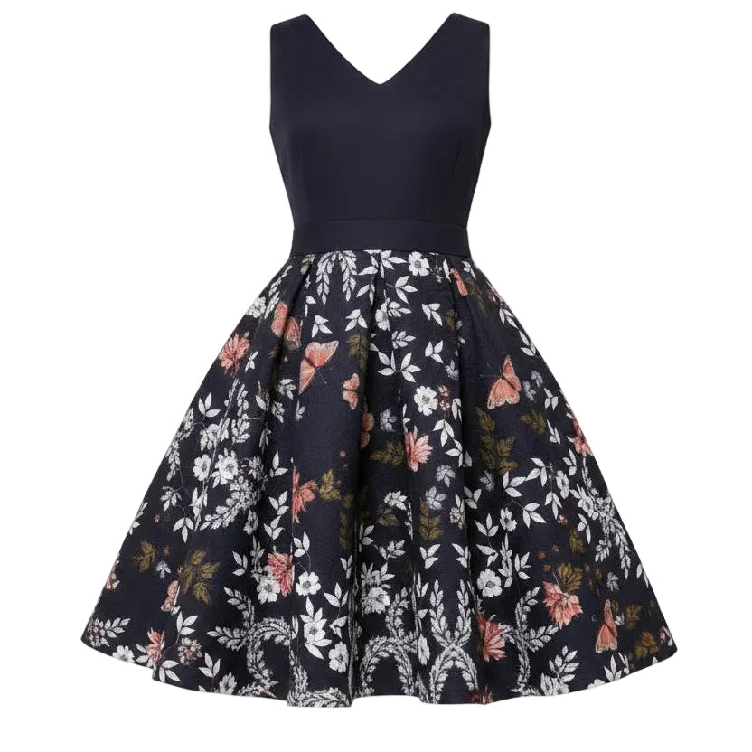 Navy dress with floral pattern worn by a model on a beige background