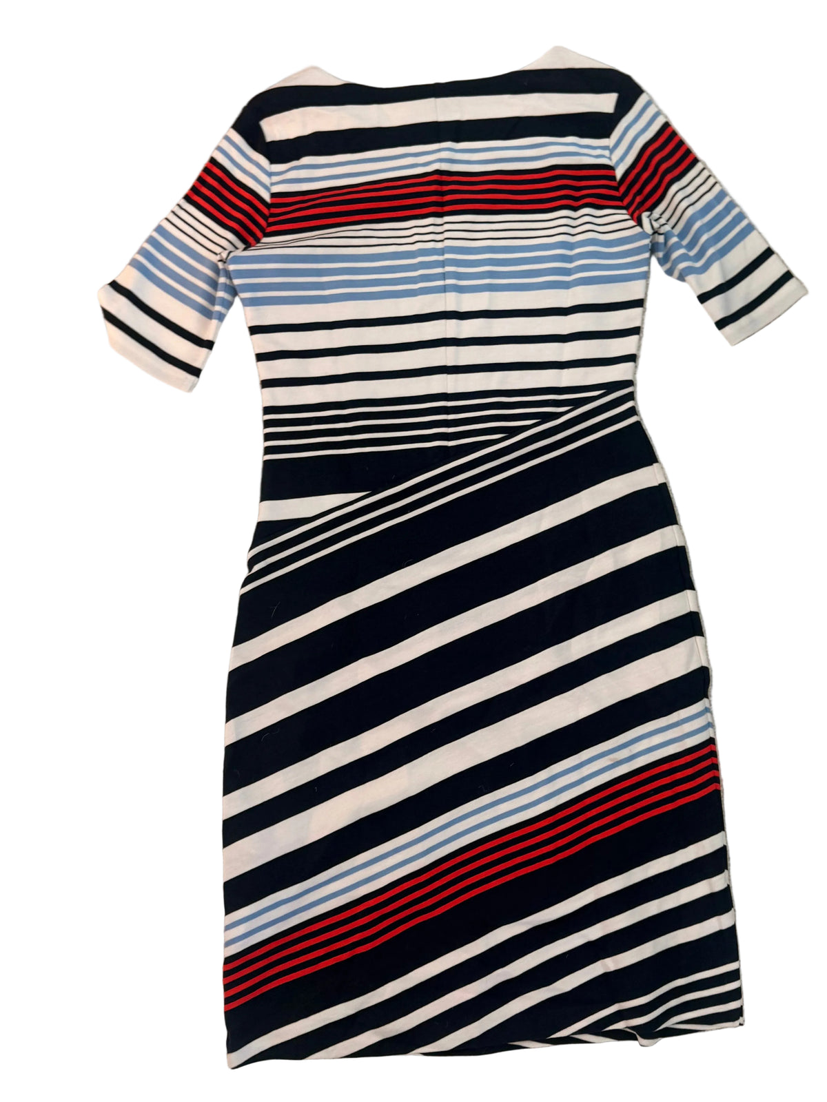 A short-sleeve knit dress with diagonal stripes in navy, white, light blue, and red, laid flat on a textured beige fabric background.