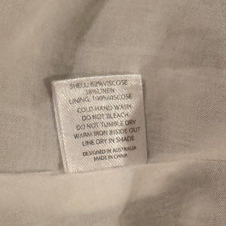 Close-up of a fabric with a label on a white background