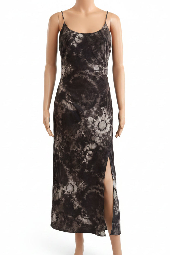 A sleeveless spaghetti-strap maxi dress with a dark brown and black tie-dye floral pattern, displayed on a mannequin torso against a white background.