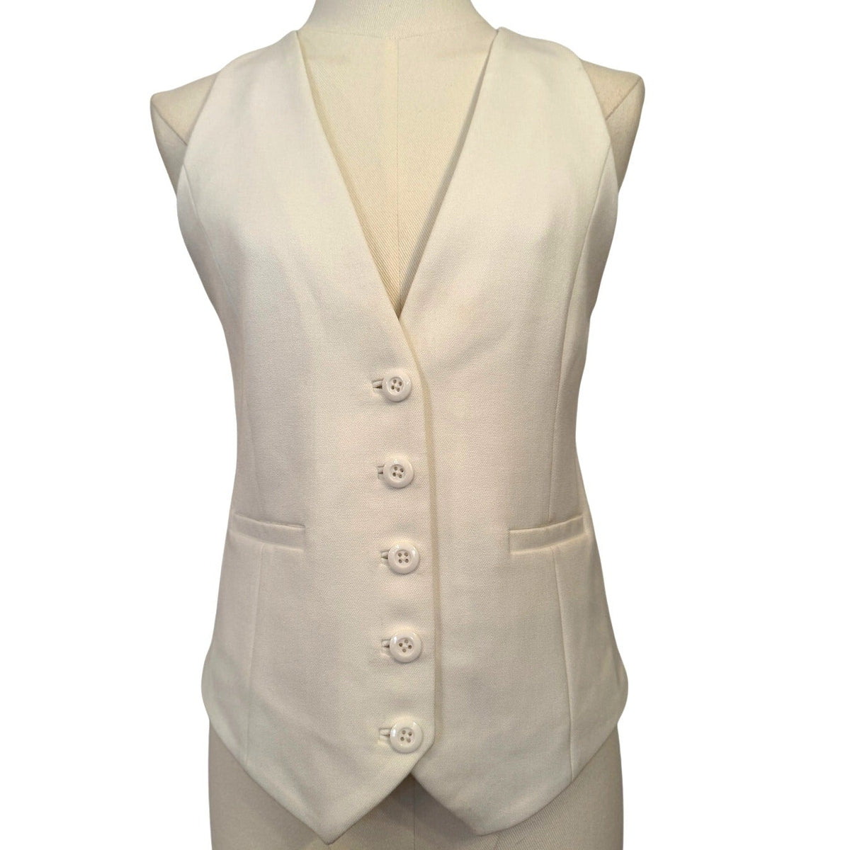 Beige waistcoat on a mannequin against a white background