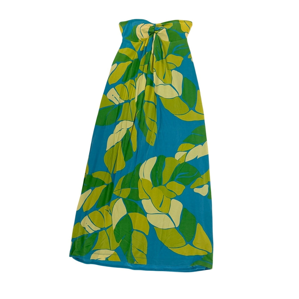 A strapless maxi dress featuring a vibrant tropical leaf print in green, lime, and yellow over a bright turquoise blue background, shown against a plain white studio backdrop.