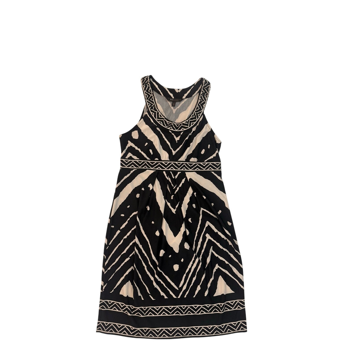 A sleeveless black dress with a beige geometric tribal pattern, featuring zig-zag stripes, dotted accents, and a patterned border on the neckline and hem, shown against a plain white background.