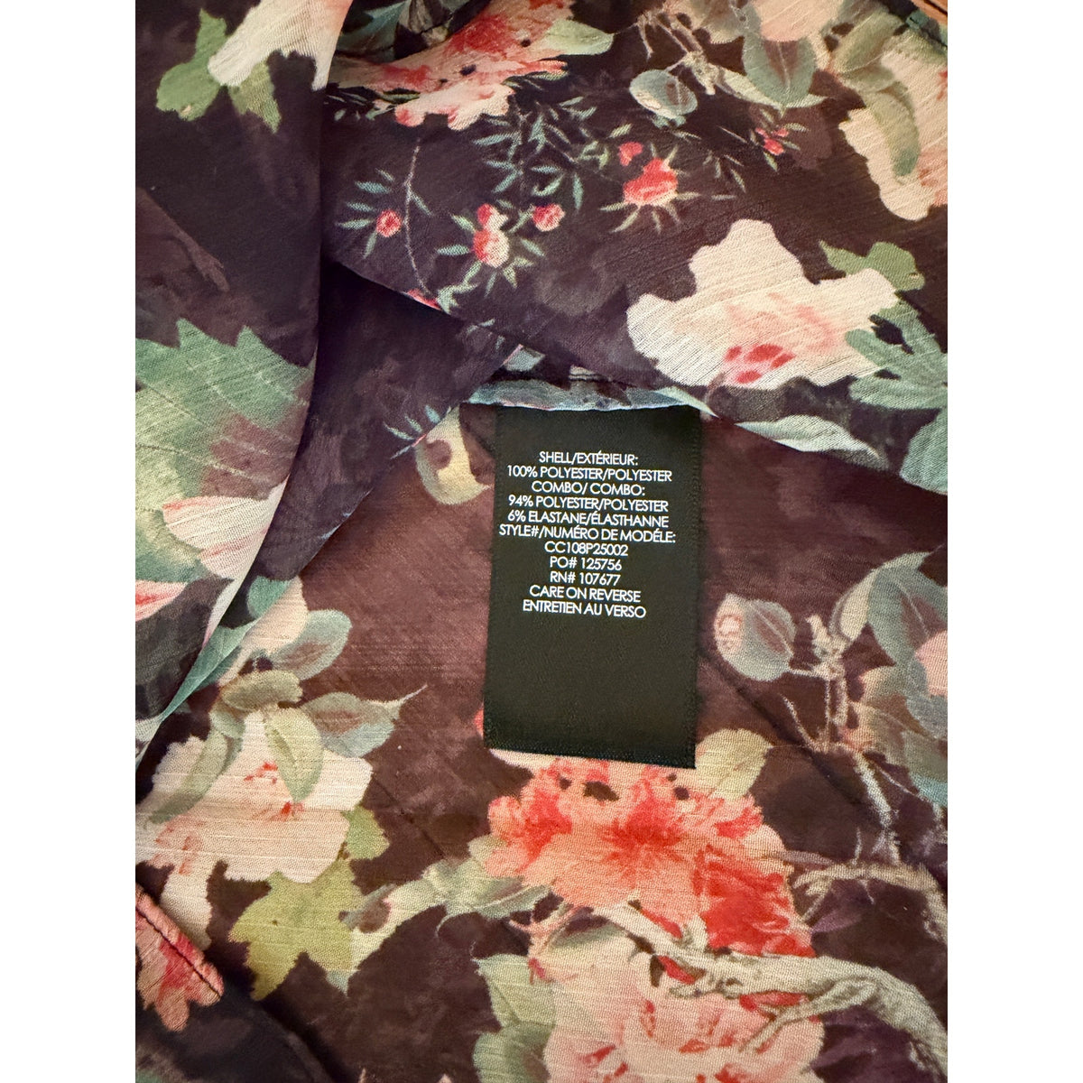 Floral patterned fabric with a label on a white background