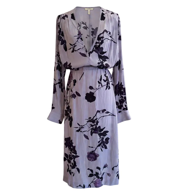 Floral dress on a mannequin against a white background